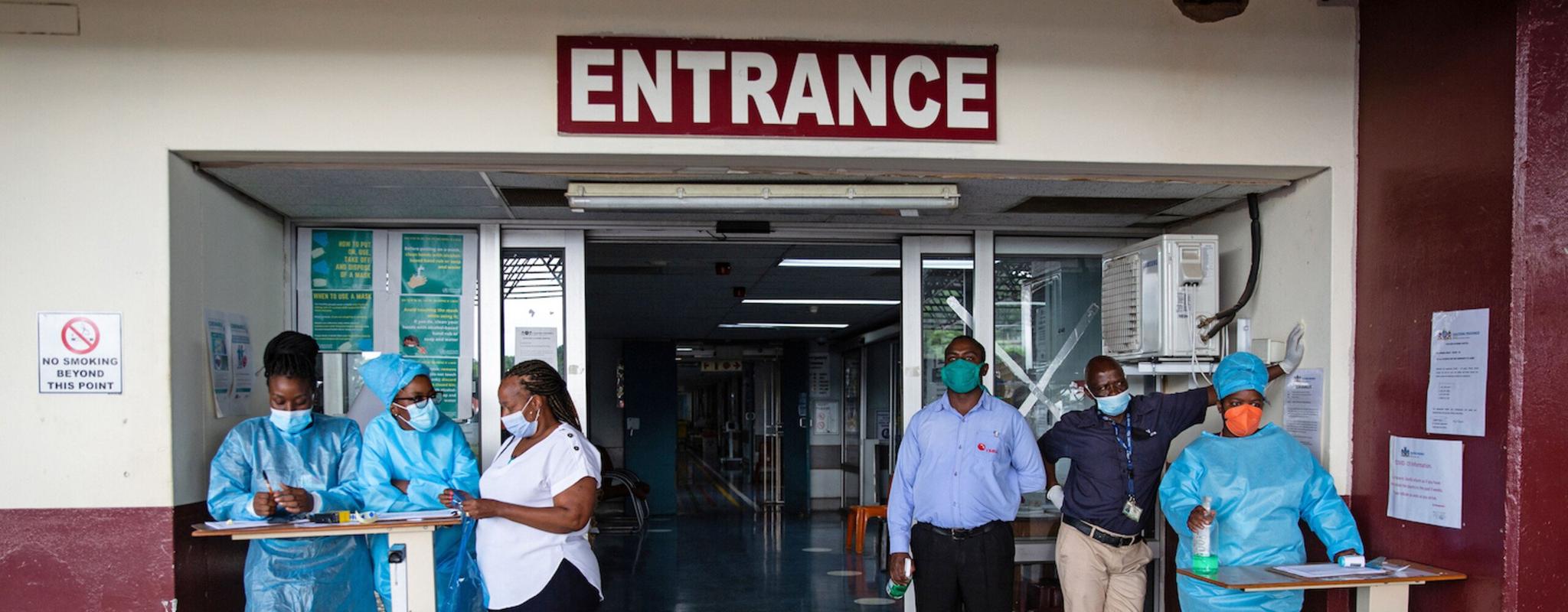 Nursing staff wait outside the Steve Biko Academic Hospital in Pretoria.