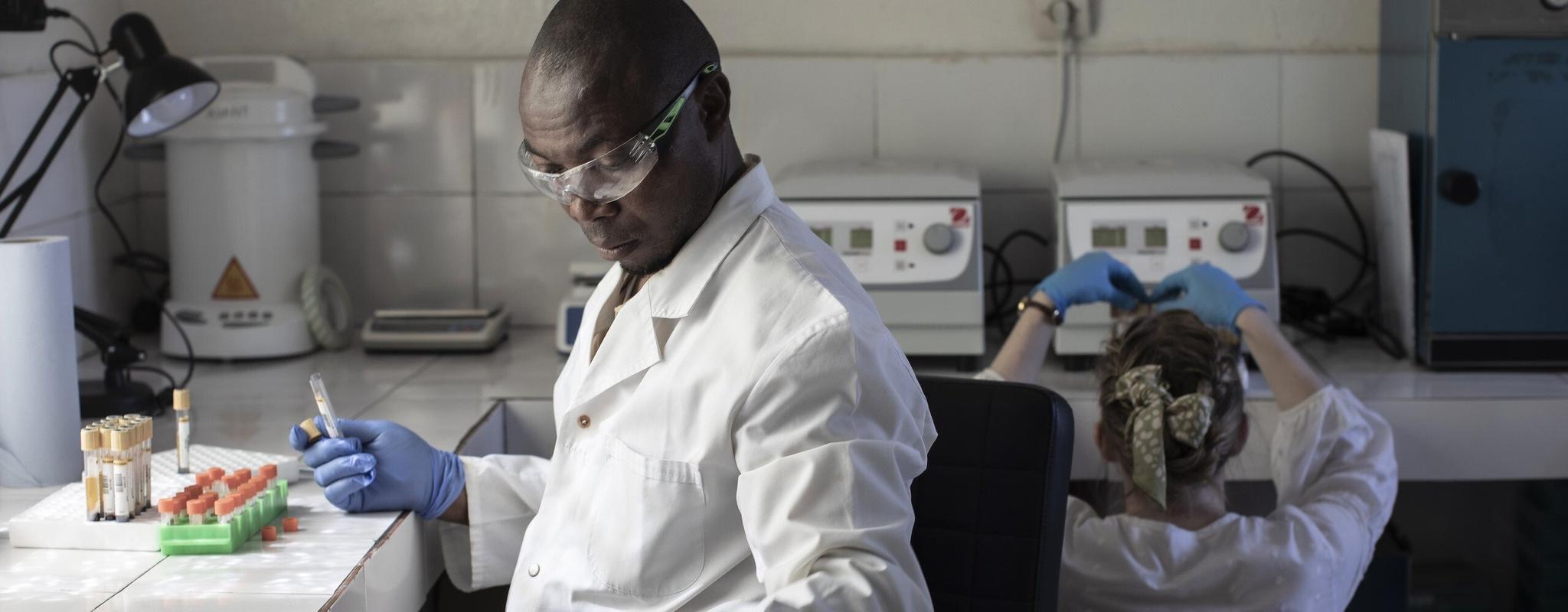 A healthcare worker analyses samples in a hospital laboratory.