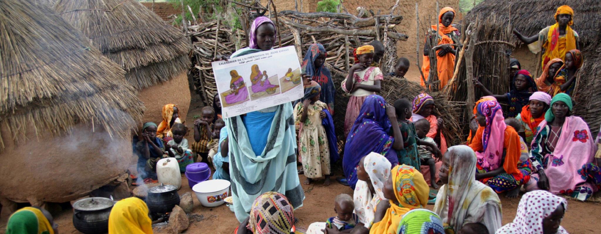 A health educator talks to women about mother and child healthcare in a village in Chad