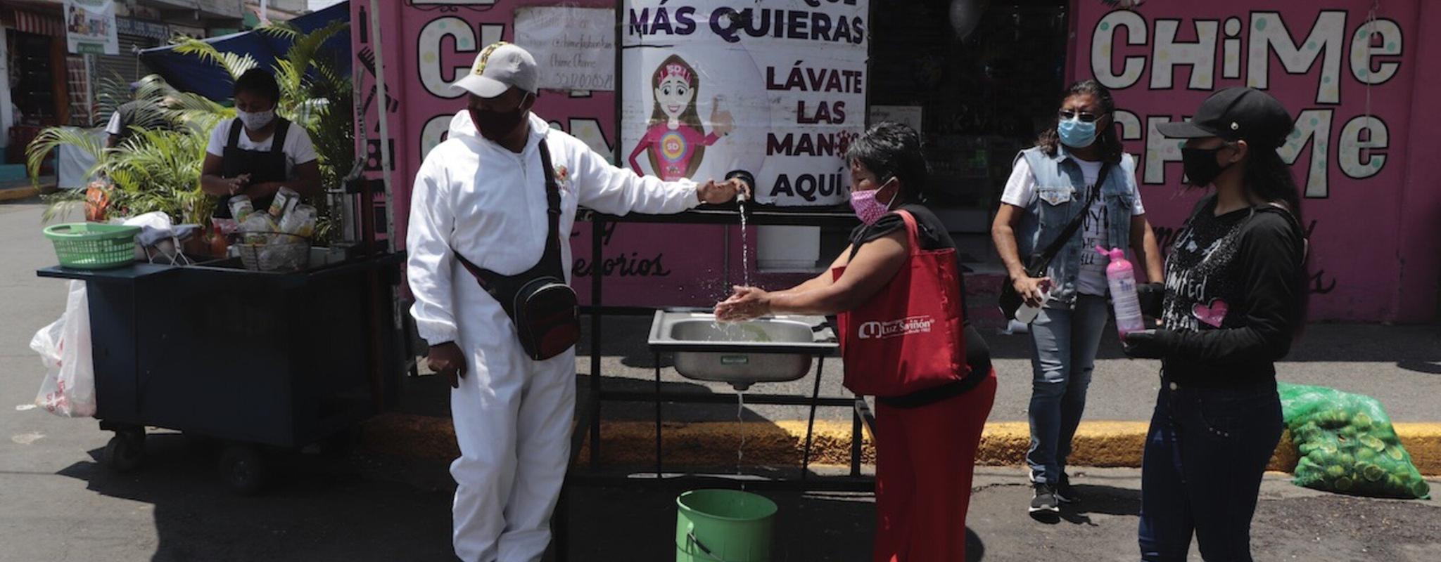 Residents in Mexico City wash their hands as a preventive measure against the spread of Covid-19.