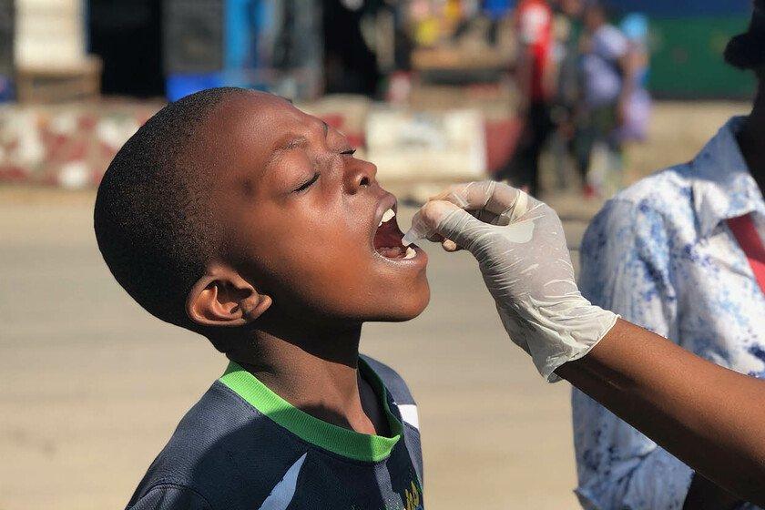 A young boy receives the oral cholera vaccine.