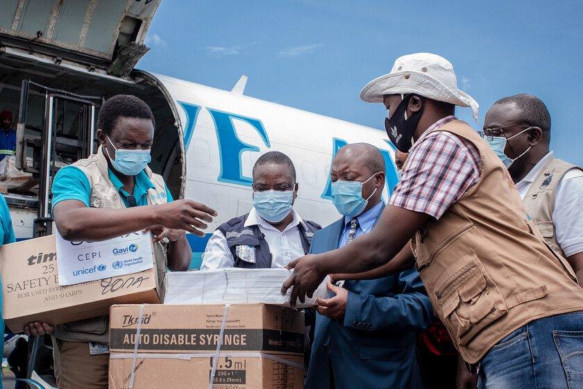 Airport staff and health personnel handle doses of Covid-19 vaccine during the arrival of a new batch at Goma International Airport, Democratic Republic of Congo.