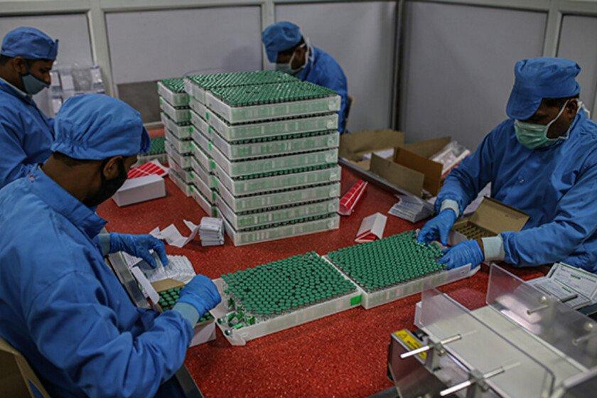 Employees packing boxes with Covid-19 vaccine at the packaging and dispatch department in Pune, Maharashtra, India, on Tuesday, 23 February 2021.