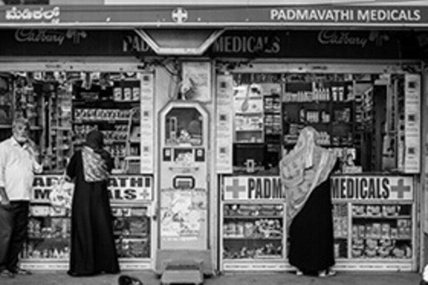 People in front of a pharmacy in India