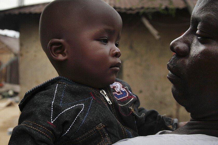 Father holding his toddler son in Bauchi, one of the regions in Nigeria affected by Lassa fever