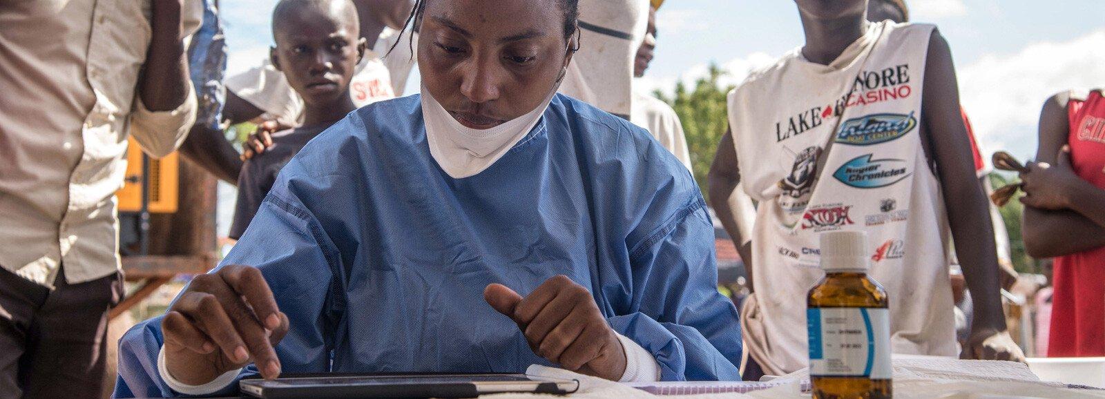 Nurses working with the World Health Organization prepare to administer vaccines in Mbandaka, the Democratic Republic of the Congo, during the launch of the 2018 Ebola vaccination campaign. 