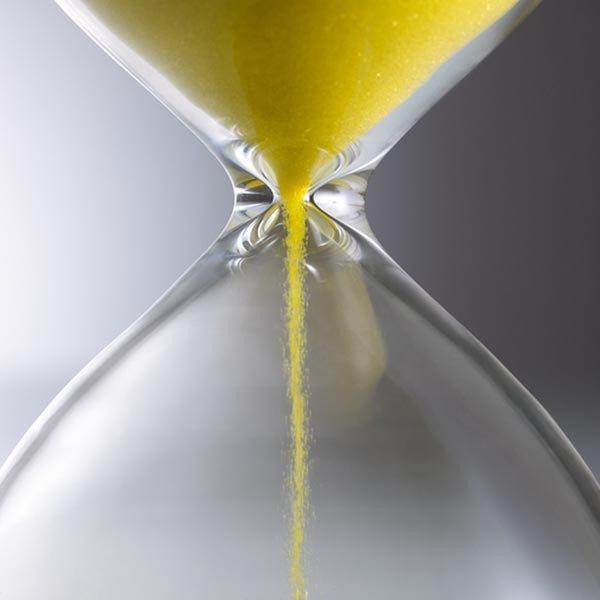 Image of sand falling through an hourglass
