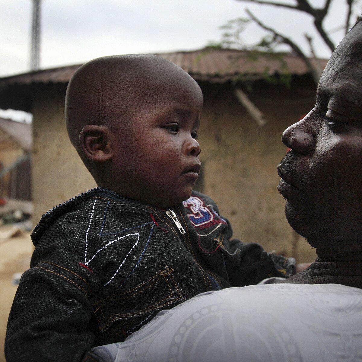 Father holding his toddler son in Bauchi, one of the regions in Nigeria affected by Lassa fever