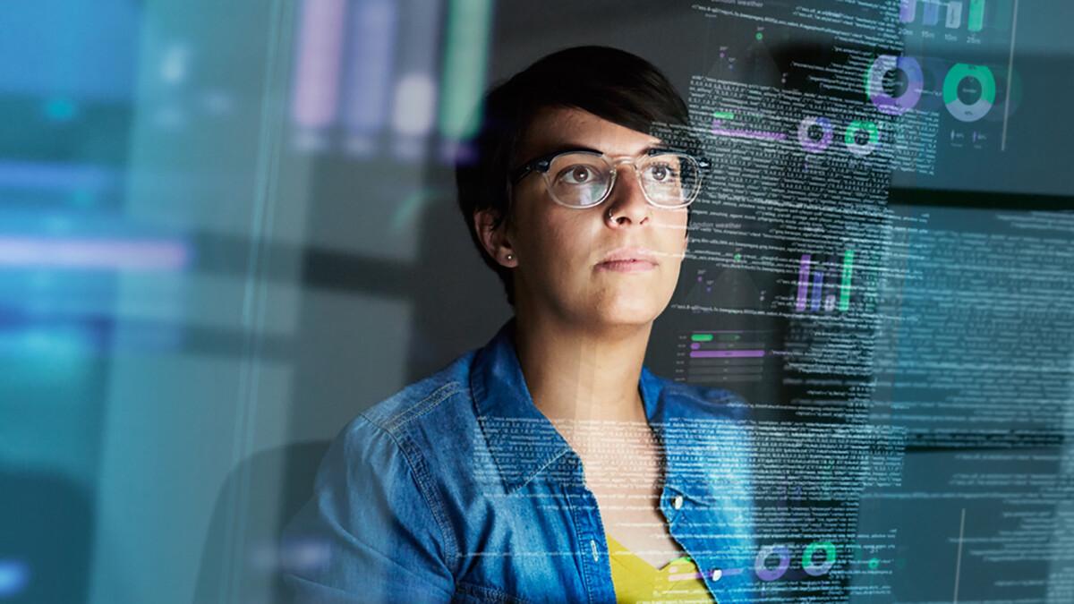 Woman looking at computer code