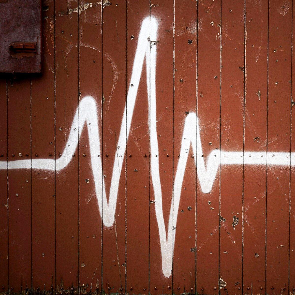 Graffiti of ECG reading on a wall